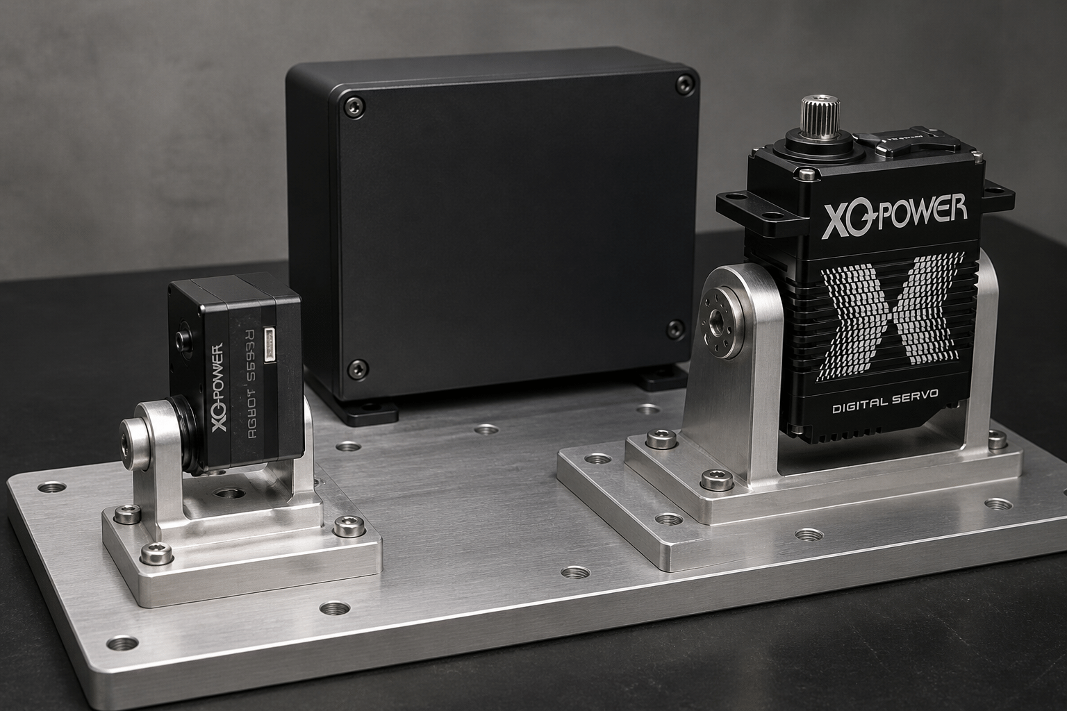 XQ-POWER servo validation bench with a large servo in a U-shaped bracket and a smaller XQ-POWER module mounted on a machined baseplate